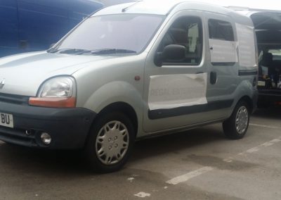 The passenger side of the van with the stickers applied