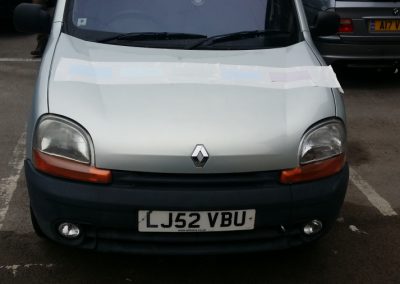 Sign being applied to Van Bonnet