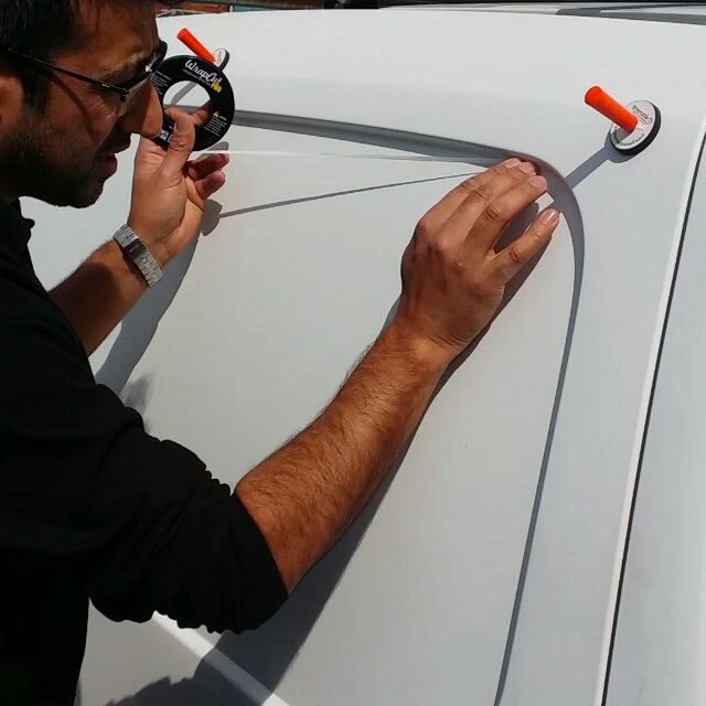 Applying knifeless tape to a van panel. This will allow us to cut the excess vinyl away leave a clean smooth finish. No need to use a bla…