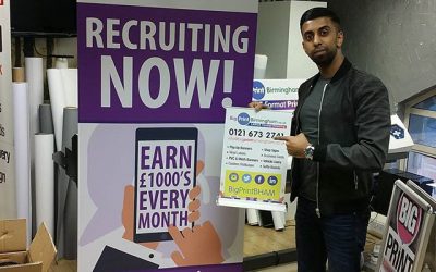 Client collecting a roller banner