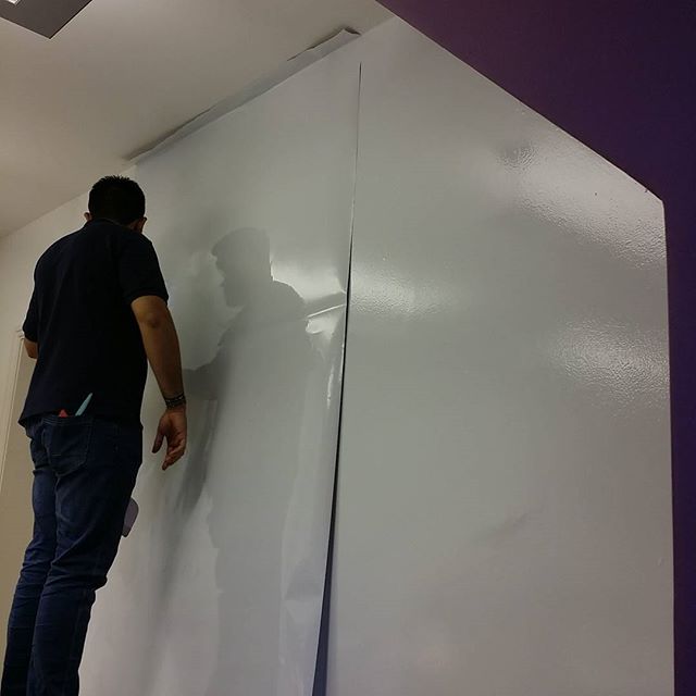 Converting this wall in to a whiteboard. Staff meetings will never be the same again for the team in this company Please like and share #bigprintbirmingham #printingbirmingham #bigprintbham #whitboardwall #whiteboard