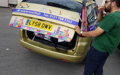 Rear view of car signs being applied. #bigprintbirmingham #printingbirmingham #signmaker #signs #printshop #shopsigns #carsigns