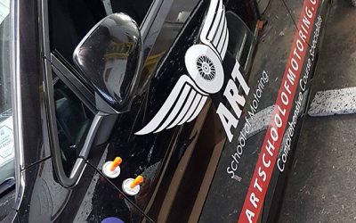 Car stickers being applied to the side of this instructor car.#bigprintbirmingham #printingbirmingham #signmaker #signs #printshop #instructorcar #learnercar