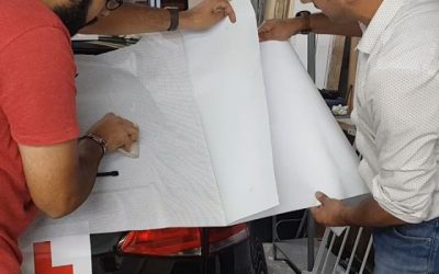 Car livery, contra vision (1 way vision ) being applied to this instructor car.#bigprintbirmingham #printingbirmingham #bigprintbham #signmaker #signs #printshop #vehiclesigns #instructor