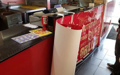 Started applying this custom wall vinyl to this counter in charcoal chicken.#bigprintbirmingham #printingbirmingham #bigprintbham #signmaker #signs #printshop #wallpaper #officewallart #counter #charcoalchicken