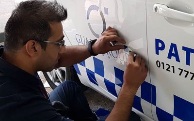 Applying the logos to the side of the car.#carlivery #carstickers #decals #car #signs #security