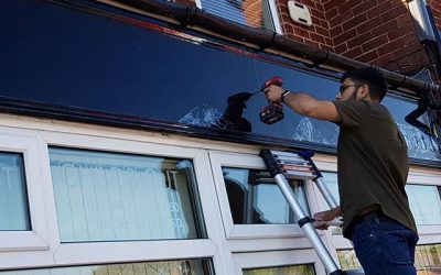 Backing board being attached to the shop. To place your order whatsapp me: Mak of Big Print Birmingham on 07702153393