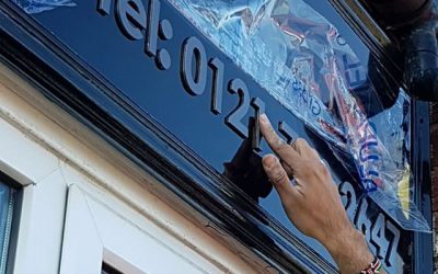 Flat cut letters being applied to the backing board. To place your order whatsapp me: Mak of Big Print Birmingham on 07702153393