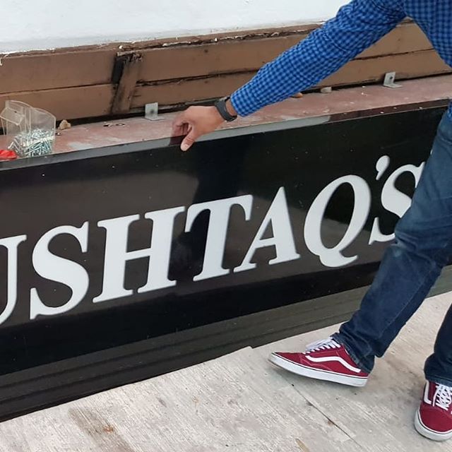 Fitting Mushtaqs sign board. To place your order whatsapp me: Mak of Big Print Birmingham on 07702153393