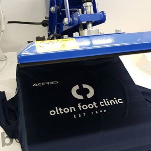 customer logo being pressed on to his garments to place your order whatsapp me mak of big print birm 1 Home Big Print Birmingham