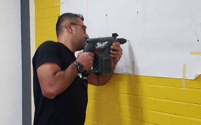 I’m fitting a logo on a wall. To place your order whatsapp me: Mak of Big Print Birmingham on 07702153393