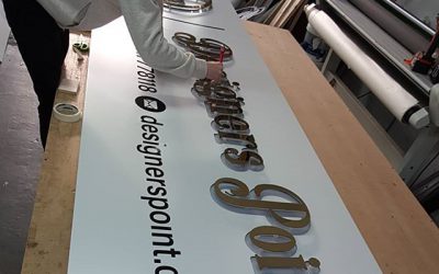Owen fixing the mirror gold flat cut raised letters to the signboard. To place an order If at all possible PLEASE whatsapp me on 07702153393